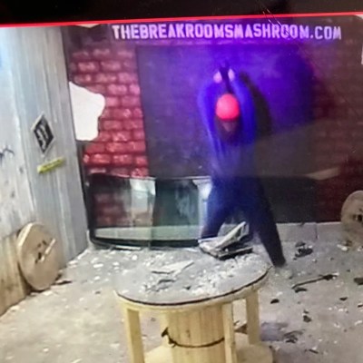 A person smashing an item