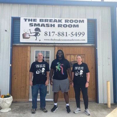 Three People Posing for a Camera