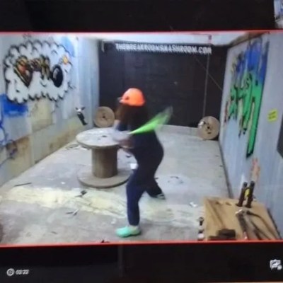A person smashing an item